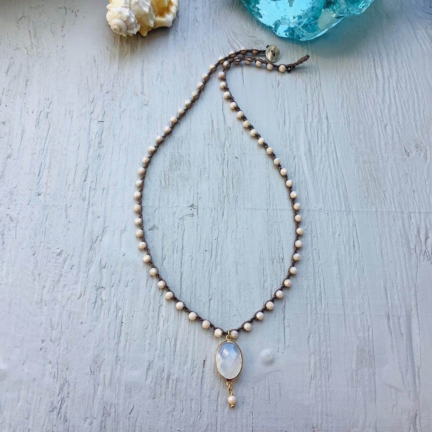 Beige/peach  crocheted crystal necklace with moonstone pendant