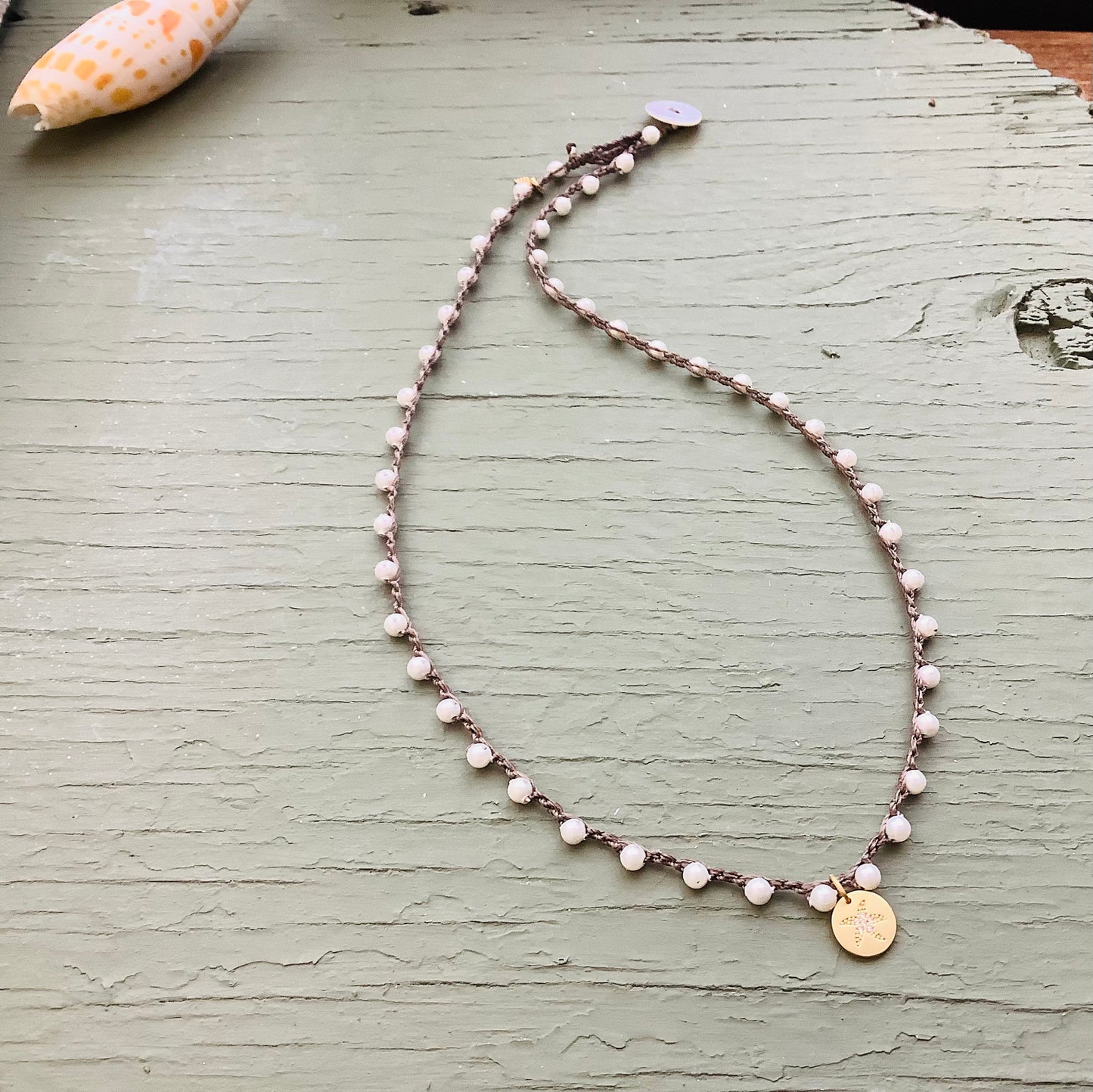 White mother of pearl crocheted necklace with silver starfish pendant