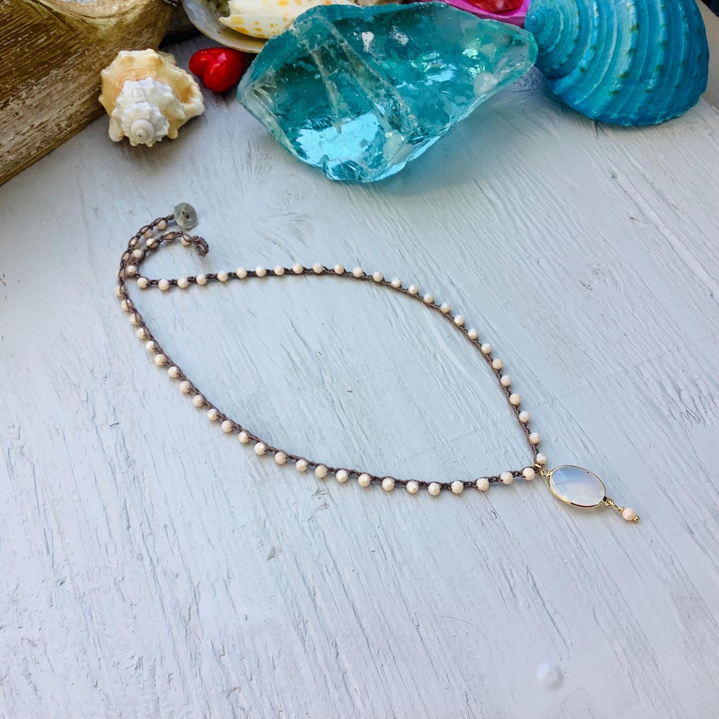Beige/peach  crocheted crystal necklace with moonstone pendant