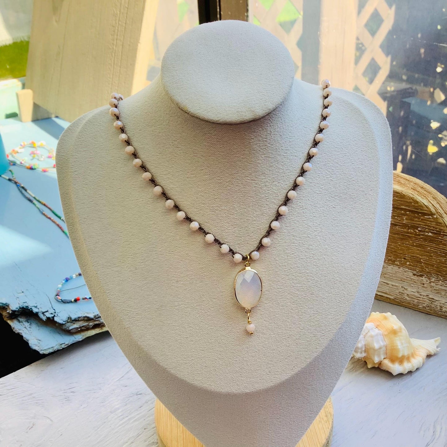 Beige/peach  crocheted crystal necklace with moonstone pendant