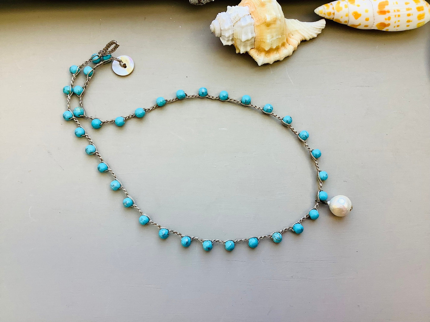 Turquoise Crocheted necklace with baroque pearl pendant