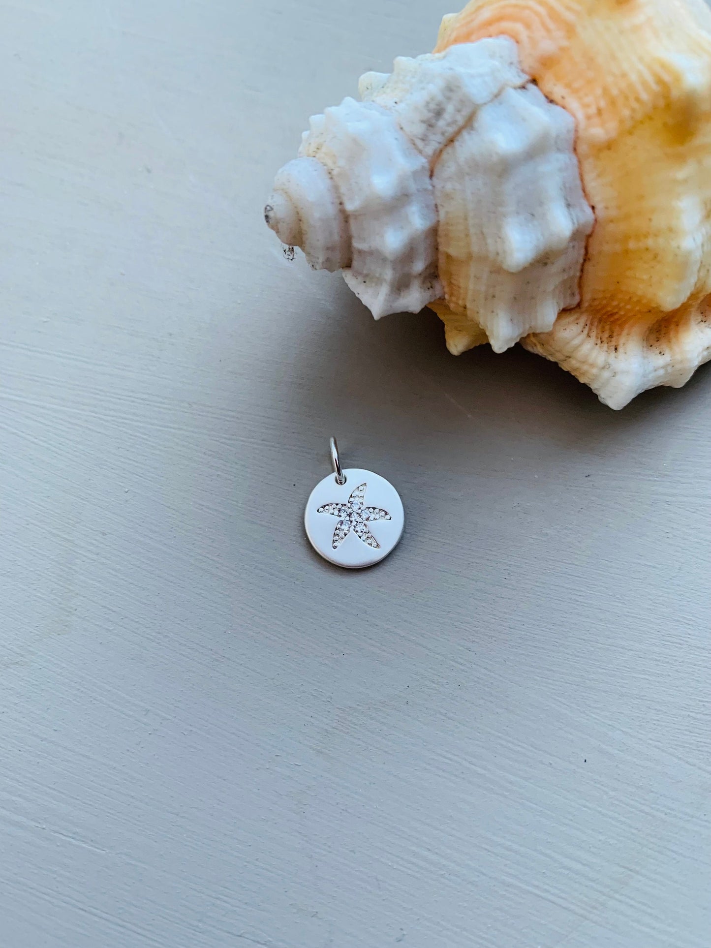 White mother of pearl crocheted necklace with silver starfish pendant