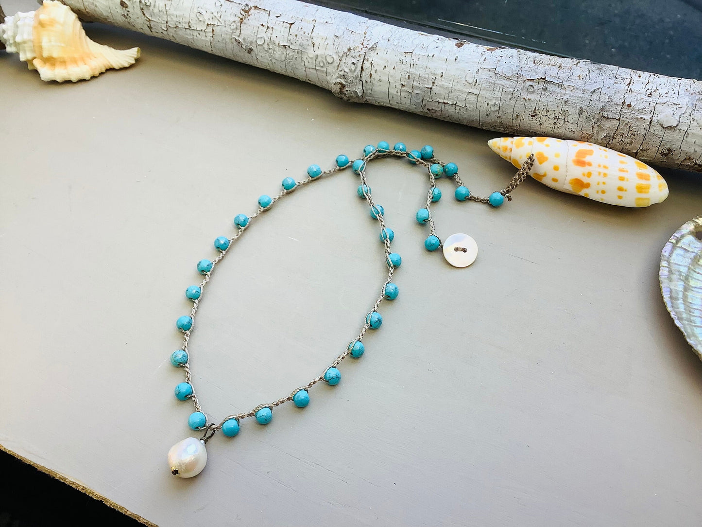 Turquoise Crocheted necklace with baroque pearl pendant