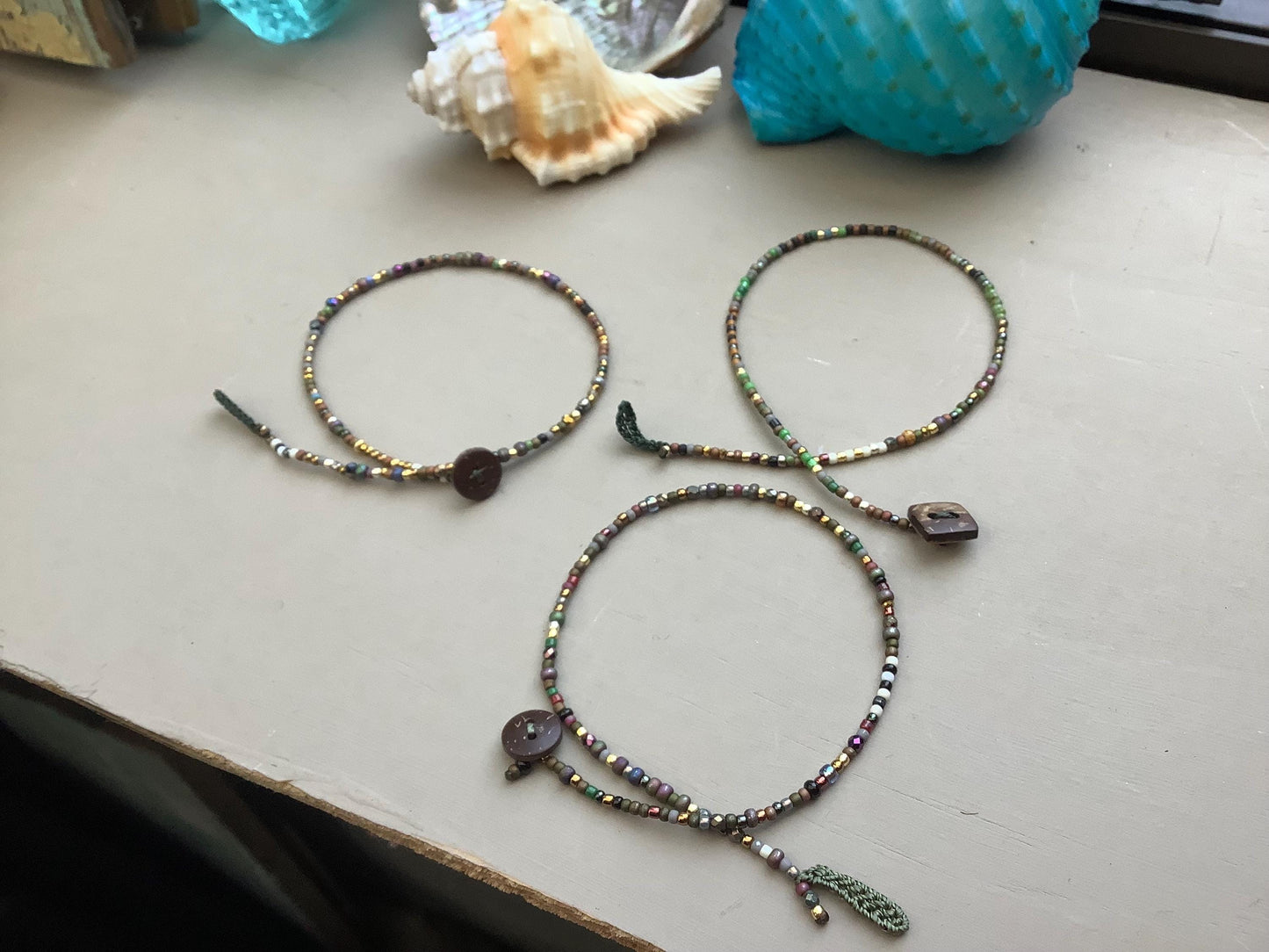 Toho petite beaded anklets with coconut button