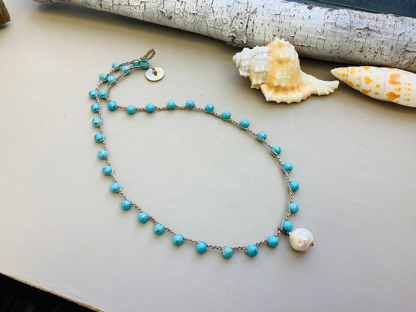 Turquoise Crocheted necklace with baroque pearl pendant