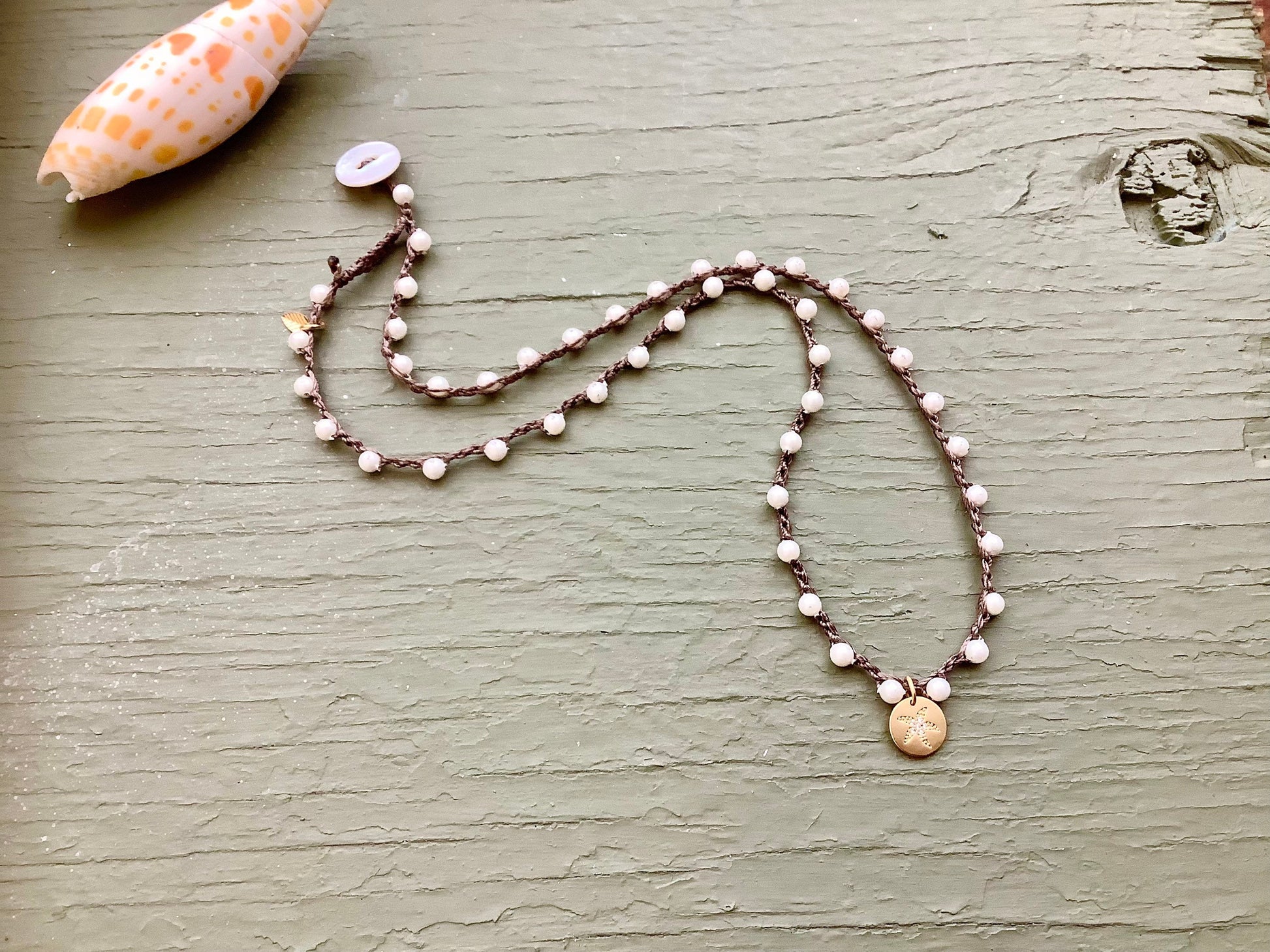 White mother of pearl crocheted necklace with silver starfish pendant